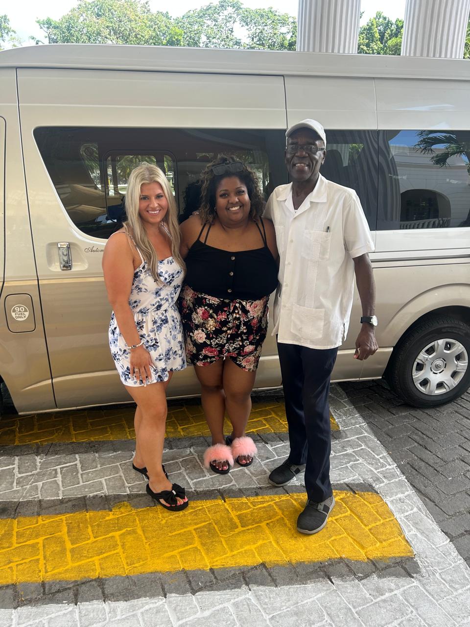 Family at Negril sign